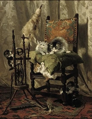 Playful kittens by a spinning wheel