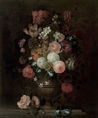 Roses, tulips, carnations, morning glory and various other flowers in a vase, on a stone ledge