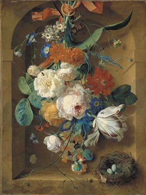 A festoon of flowers hanging from a red ribbon in a stone niche with a bird's nest
