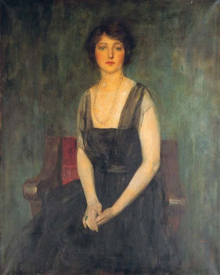 Portrait of Dorothy Duveen, three-quarter length, seated on a red chair