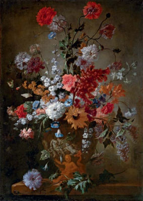 Roses, carnations, a sunflower and other flowers in a classical urn, on stone ledge