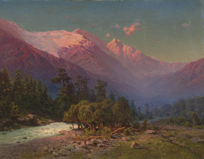 A stream running through snow-capped mountains