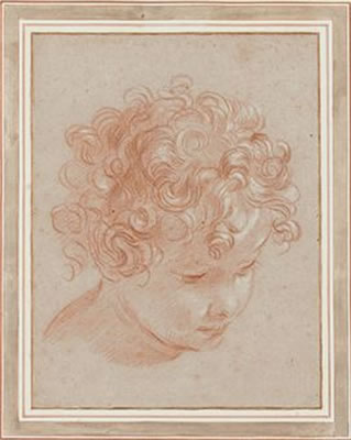 Head of a young boy with curly hair, looking down to the right