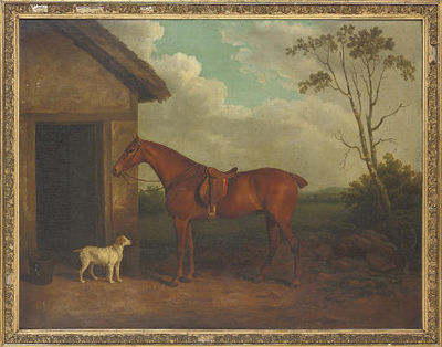 A chestnut hunter and hound outside a stable