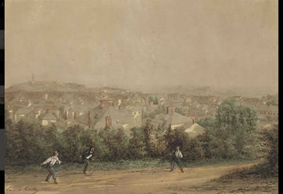 Boys playing on a lane above St. Helier with Fort Regent and Elizabeth Castle beyond