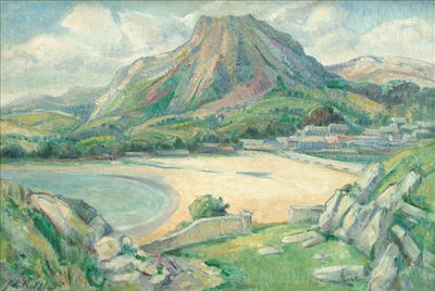 Looking across a beach at a volcano