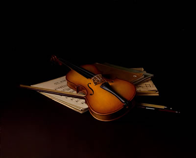 "Violín y partituras"