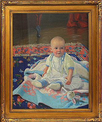A seated child on a blanket.