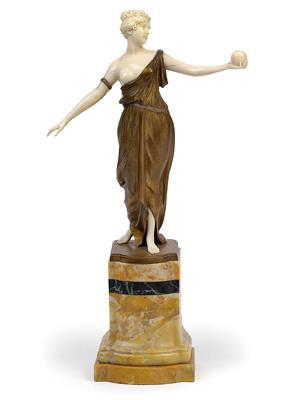 A girl with a ball dressed in the style of antiquity