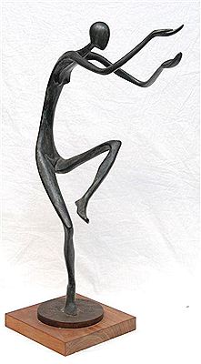 A woman standing on one foot