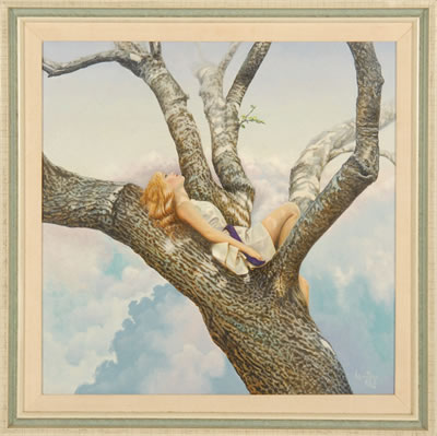 A young woman rests in a tree.