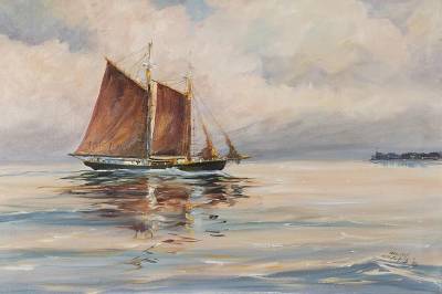 A schooner under sail at sunset