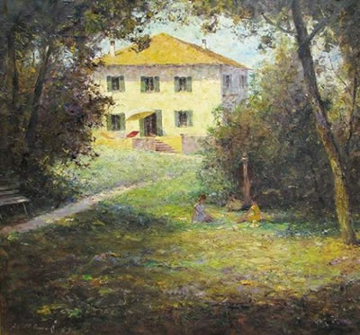 Blick auf eine sonnenbeschienene Villa im Tessin