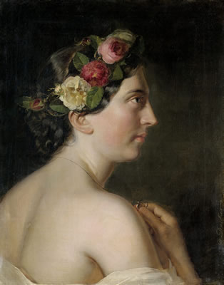Profilbild einer jungen Frau mit Blumen im Haar