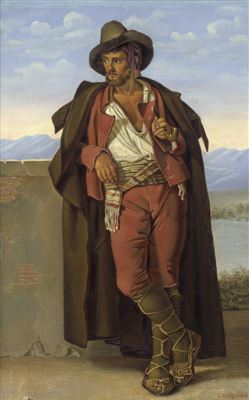 Junger Mann in Tiroler Tracht, an einer Mauer gelehnt und Pfeife