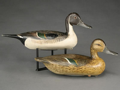 Superb pair of hollow carved pintails