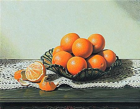 ORANGES IN A GLASS BOWL