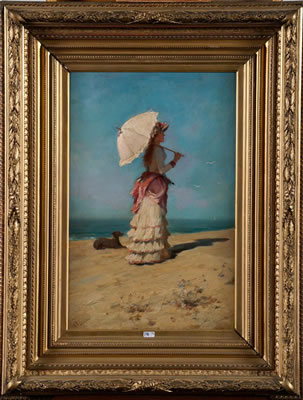 Elégante à l'ombrelle sur la plage
