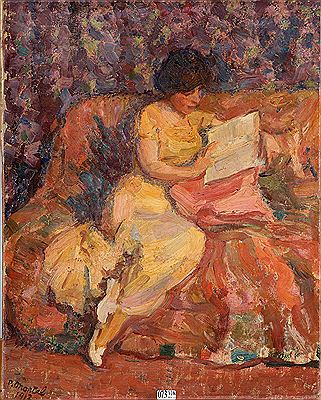 Jeune femme à la lecture dans un canapé