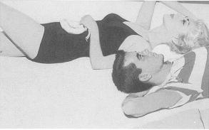 Couple lying down at beach