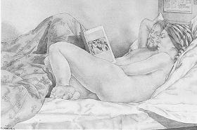 Couple in bed with book