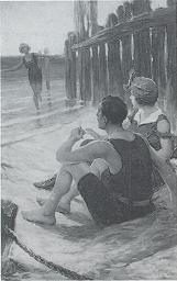 Couple seated on beach