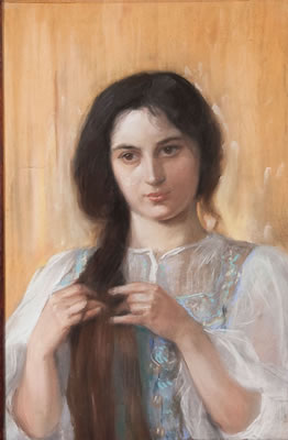 A Young Woman Braiding Her Hair