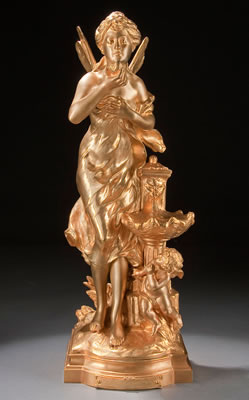 Amour a La Source a gilt bronze figure of a standing nymph with cupid at feet drinking from the fountain of love. Inscribed on base "Math. Moreau" and with engraved title plaque. Height 22 inches (56 cm).