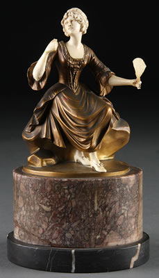 FIGURE OF A SEATED WOMAN WITH FAN