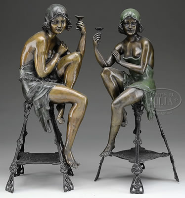 PAIR OF SEATED FLAPPERS TOASTING A GLASS