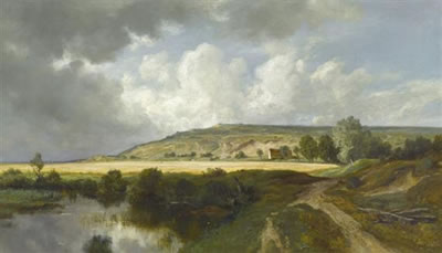 Berglandschaft mit einem Bach im Vordergrund.