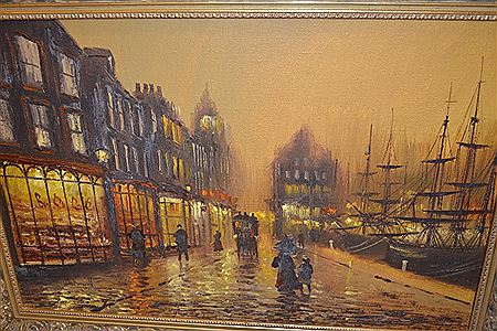 A Victorian quayside street scene with figures, horse drawn carriage, shops and sailing vessels