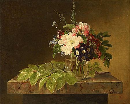 FLOWERS IN A GLASS VASE ON A MARBLE TABLE