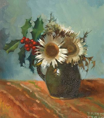 Stechpalme und Disteln in Vase