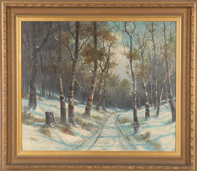 Winter landscape with pathway through deciduous forest