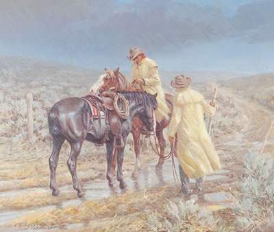 Two cowboys in yellow slickers closing a gate in a rain storm.