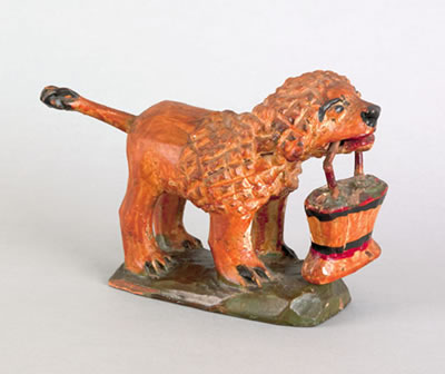 DOG CLUTCHING A BASKET