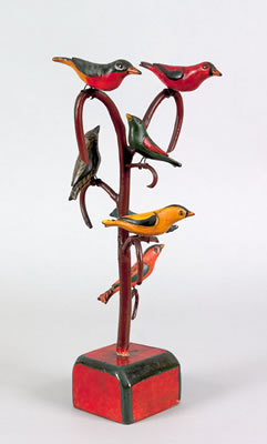 Carved and painted bird tree with seven polychrome decorated birds