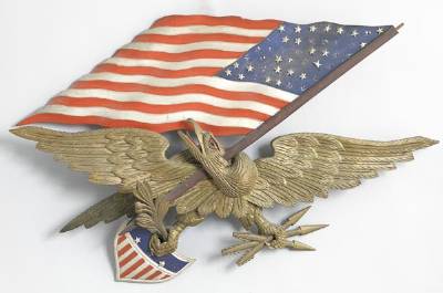 Rare carved plaque of a spread winged eagle