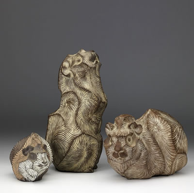 Three ceramic guinea pig sculptures
