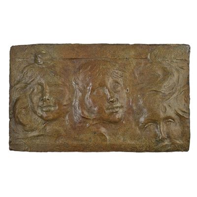 Glazed stoneware architectural panel carved with faces, France, ca. 1900