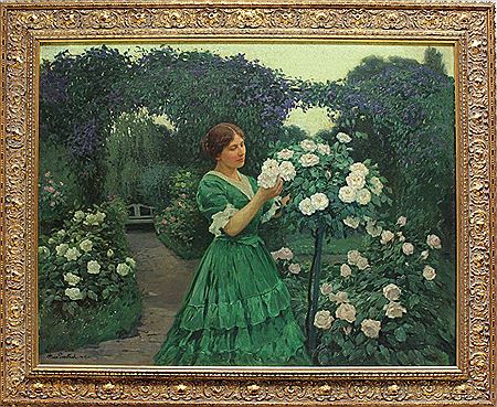 Mädchen in einem blühenden Rosengarten: "Rosenzeit"