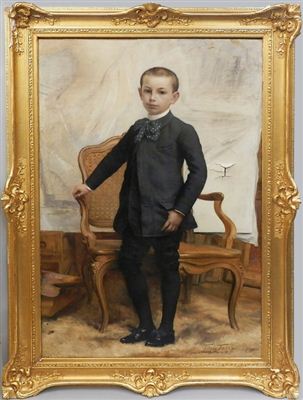Portrait of a boy, standing full-length in an interior