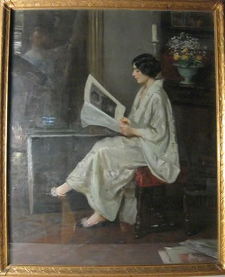Portrait of a woman seated , dressed in white and reading a magazine