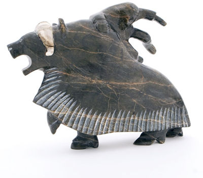 Cape Dorset. Man on Muskox