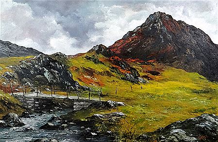 Footbridge over stream with mountain in background, possibly Tryfan, Snowdonia
