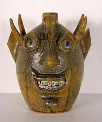 Double Face Devil Jug by John Meaders - Auction record, sale price, and art valuation. Compare with similar artists and explore comparable artworks.