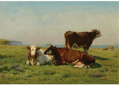 COWS GRAZING BY THE SEA