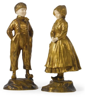 A PAIR OF GILT-BRONZE AND IVORY FIGURES OF A DUTCH BOY AND GIRL