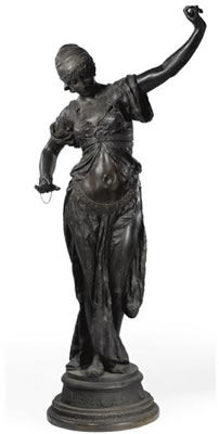 A LIFE SIZE FIGURE OF A DANCING ORIENTAL COURTESAN